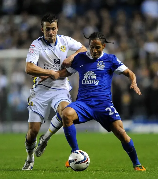 Framed Print : Battling for Control: Pugh vs. Pienaar in the Intense Capital One Cup Clash between Leeds United and Everton Framed Print : Battling for Control: Pugh vs. Pienaar in the Intense Capital One Cup Clash between Leeds United and Everton