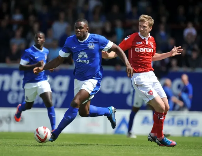 Framed Print : Clash at Globe Arena: Everton's Victor Anichebe vs Morecambe's Andy Wright
