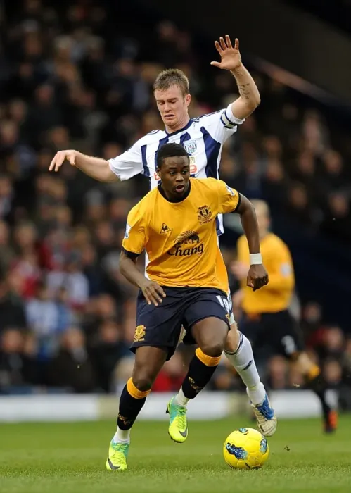 Framed Print : Clash at The Hawthorns: Brunt vs. Gueye - Everton vs. West Bromwich Albion (01.01.2012) - Premier League Showdown Framed Print : Clash at The Hawthorns: Brunt vs. Gueye - Everton vs. West Bromwich Albion (01.01.2012) - Premier League Showdown