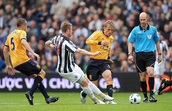 Clash at The Hawthorns: Neville vs. Brunt - Everton vs. West Bromwich Albion's Intense Premier League Battle (14 May 2011)
