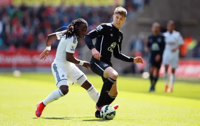 Framed Print : Clash of Stars: Emnes vs. Stones - Swansea City vs. Everton, Barclays Premier League Framed Print : Clash of Stars: Emnes vs. Stones - Swansea City vs. Everton, Barclays Premier League
