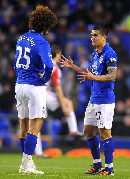 Deep in Thought: Tim Cahill and Marouane Fellaini's Intense Conversation at Goodison Park (Everton vs Stoke City, Barclays Premier League, 04 December 2011)