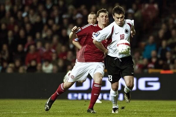 Denmarks Jacobsen fights for the ball with Albanias Hamdi Salihi during their 2010 World Cup qualifying soccer match in Copenhagen