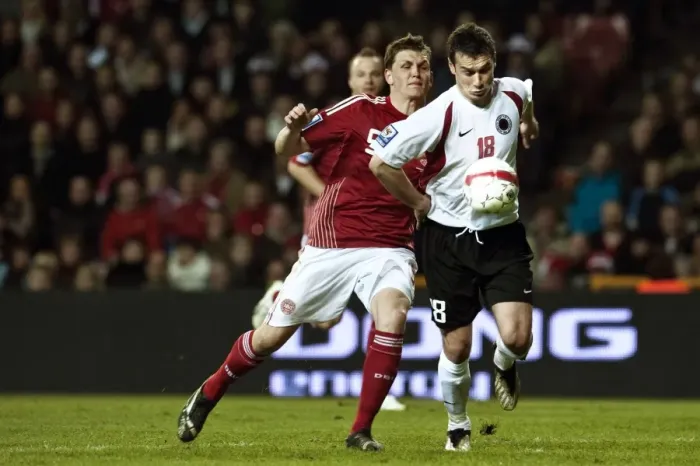 Framed Print : Denmarks Jacobsen fights for the ball with Albanias Hamdi Salihi during their 2010 World Cup qualifying soccer match in Copenhagen Framed Print : Denmarks Jacobsen fights for the ball with Albanias Hamdi Salihi during their 2010 World Cup qualifying soccer match in Copenhagen