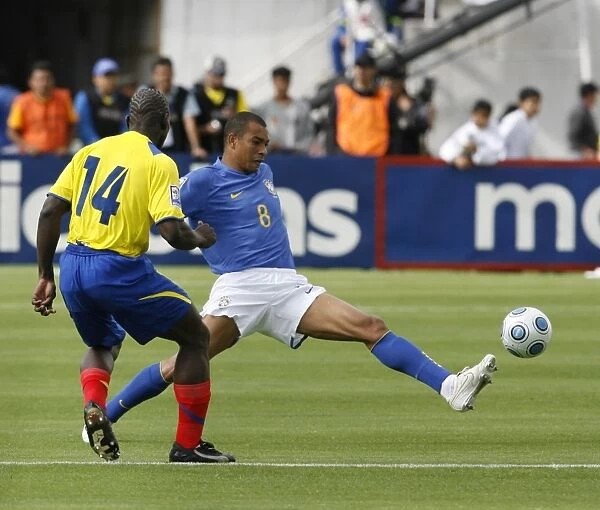 Ecuadors Castillo fights for ball with Brazils Silva during their 2010 World Cup qualifying soccer match in Quito