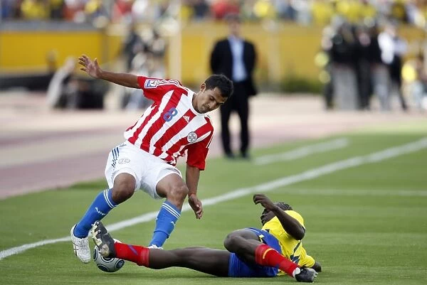 Ecuadors Castillo tackles Paraguays Aquino during their 2010 World Cup qualifying soccer match in Quito