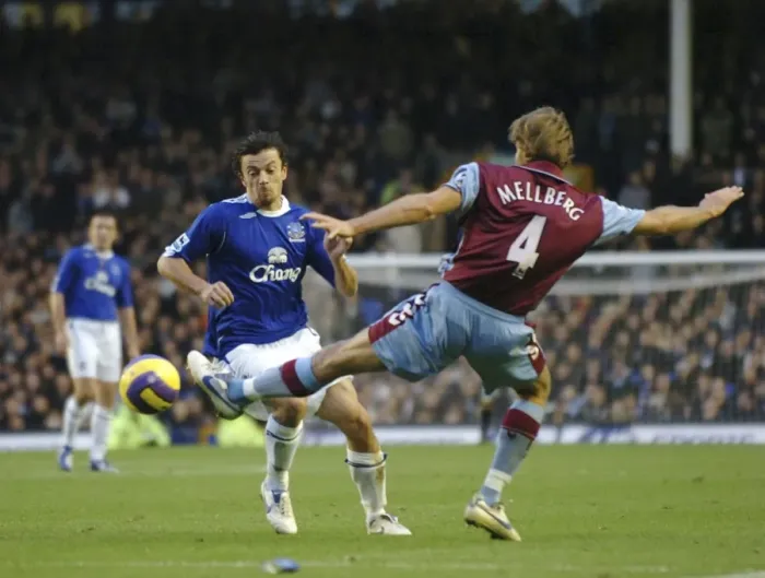 Framed Print : Everton v Aston Villa Simon Davies in action against Olof Mellberg Framed Print : Everton v Aston Villa Simon Davies in action against Olof Mellberg