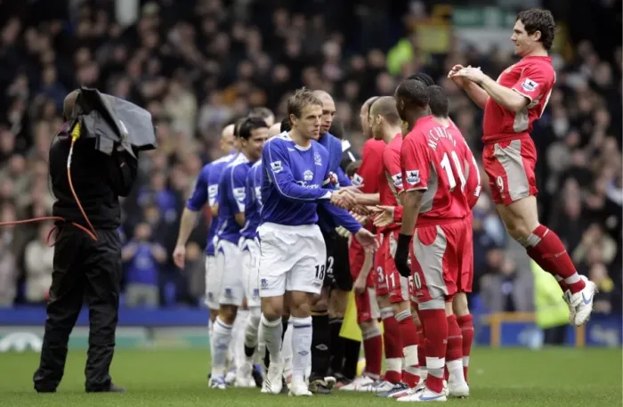 Framed Print : Everton v Blackburn Rovers Phil Neville leads his team as they shake hands with the Blackburn players