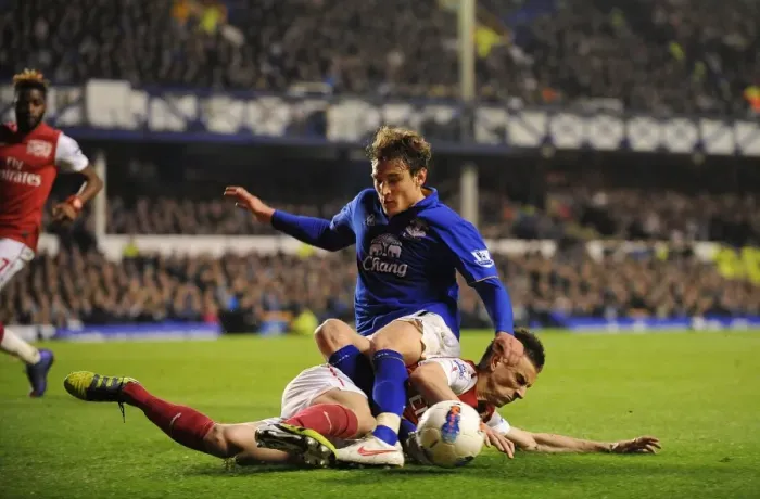 Framed Print : Everton vs. Arsenal: Jelavic vs. Koscielny - The Intense Battle for the Ball (Premier League, March 21, 2012)