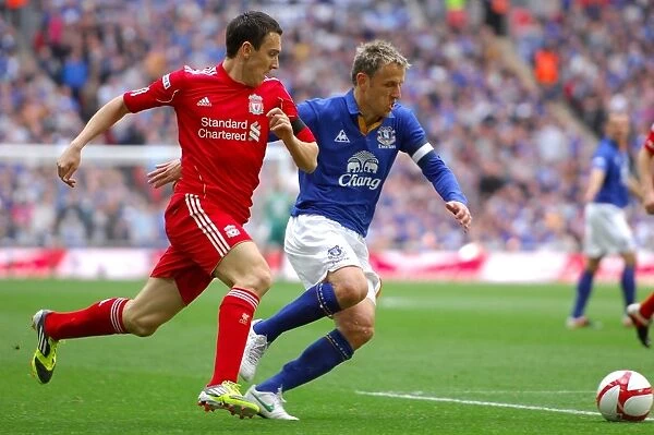 Everton vs Liverpool FA Cup Semi-Final Showdown: Neville vs Downing at Wembley Stadium - A Riveting Battle for the Ball