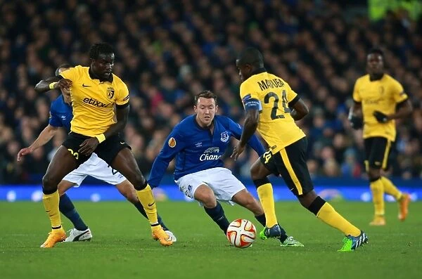 Everton's Aiden McGeady Fights for Possession in Europa League Clash vs Lille