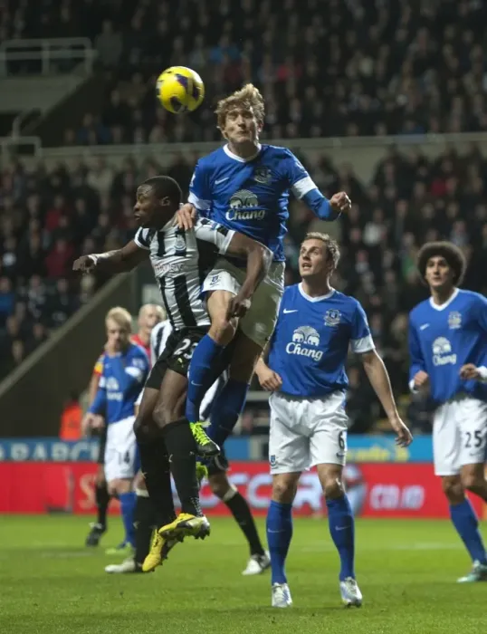Framed Print : Everton's Air Battle: Ameobi vs. Jelavic in the Intense Clash at St. James Park (2-1, Premier League, 02-01-2013)