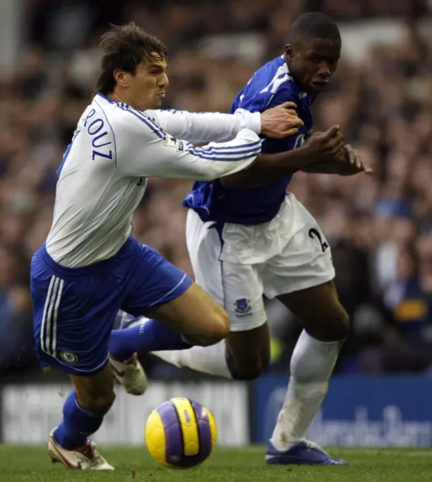 Framed Print : Evertons Anichebe is held back by Chelseas Boulahrouz during their English Premier League soccer m Framed Print : Evertons Anichebe is held back by Chelseas Boulahrouz during their English Premier League soccer m