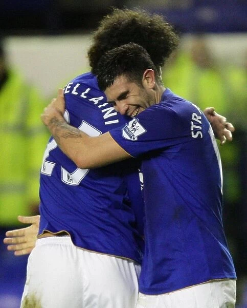 Everton's Denis Stracqualursi and Marouane Fellaini Celebrate Goal in FA Cup Fourth Round Match vs Fulham
