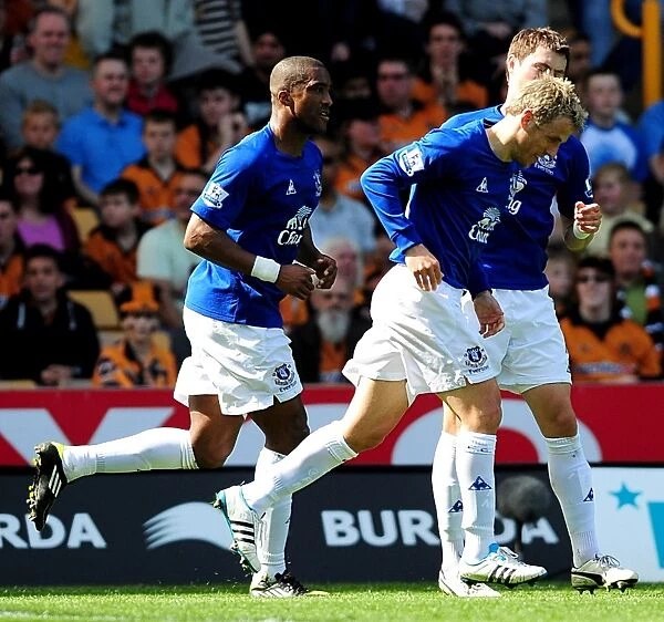 Everton's Double Delight: Neville Scores Brace as Toffees Triumph Over Wolves (09 April 2011)