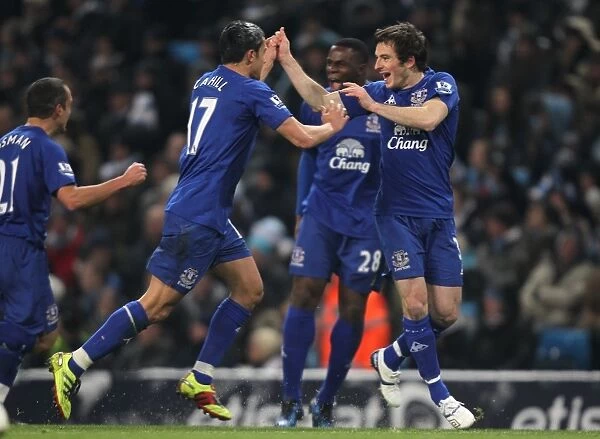 Everton's Glorious Moment: Tim Cahill and Leighton Baines Celebrate Their Goals Against Manchester City (2010)