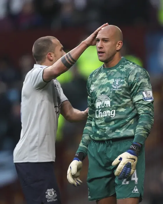 Framed Print : Everton's Heitinga Comforts Howard: A Moment of Solidarity on the BPL Battlefield (14 January 2012, Aston Villa vs. Everton)