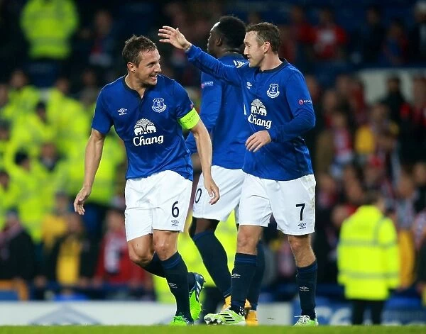 Everton's Jagielka and McGeady Celebrate Second Goal in Europa League Match against Lille