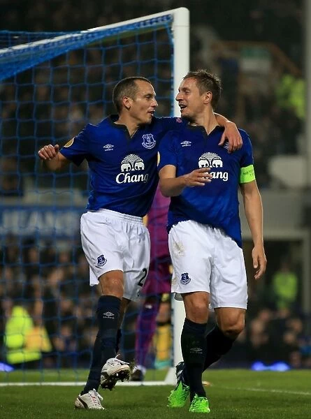Everton's Jagielka and Osman: Celebrating a Europa League Double Strike Against Lille