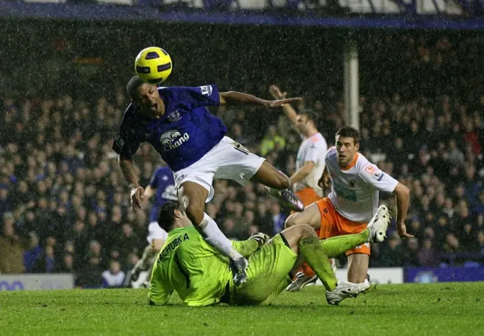 Framed Print : Everton's Jermaine Beckford Tumbles After Collision with Blackpool's Paul Rachubka (05 February 2011) Framed Print : Everton's Jermaine Beckford Tumbles After Collision with Blackpool's Paul Rachubka (05 February 2011)
