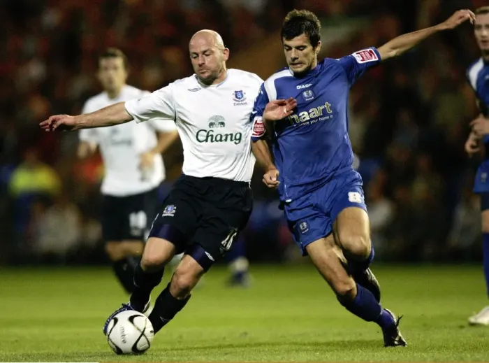 Framed Print : Evertons Lee Carsley and Peterbroughs Richard Butcher in action Framed Print : Evertons Lee Carsley and Peterbroughs Richard Butcher in action