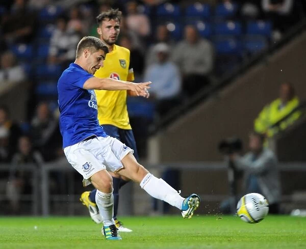 Everton's Luke Garbutt Aims for the Win: Pre-Season Showdown vs. Oxford United at Kassam Stadium (2011)