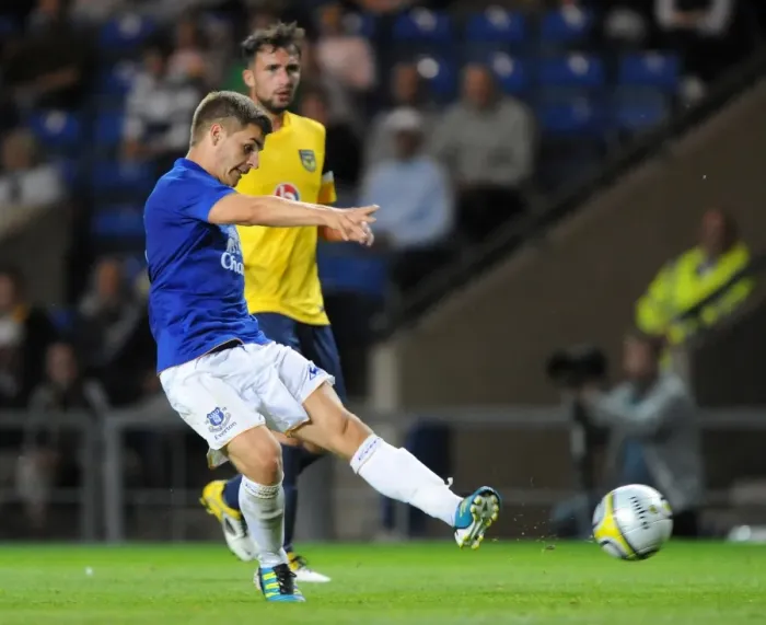 Framed Print : Everton's Luke Garbutt Aims for the Win: Pre-Season Showdown vs. Oxford United at Kassam Stadium (2011)