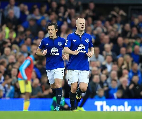 Everton's Naismith and Baines Celebrate Second Goal Against Chelsea at Goodison Park