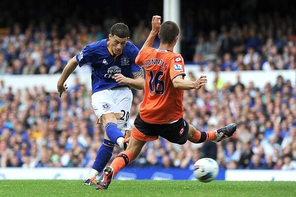 Everton's Ross Barkley Unleashes a Powerful Shot Against Queens Park Rangers (2011)