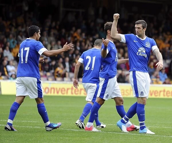 Everton's Shane Duffy Scores and Celebrates with Team-mates in Pre-Season Friendly against Motherwell