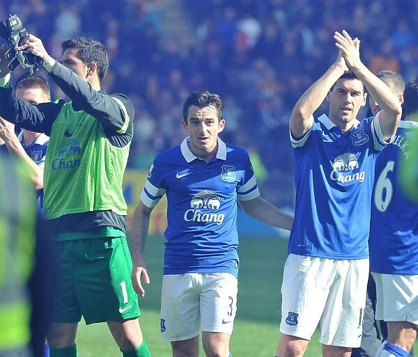 Everton's Triumph: Baines, Barry, and Robles Celebrate with Fans after Hull City Victory (May 11, 2014)