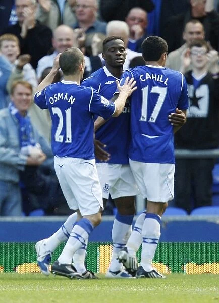 Everton's Triumph: Saha, Osman, and Cahill Celebrate First Goal vs. West Ham United, May 2009