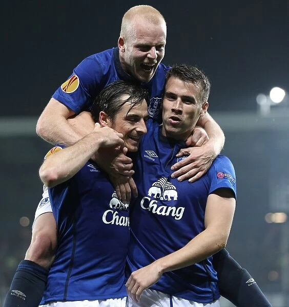 Everton's Triumphant Trio: Coleman, Baines, and Naismith Celebrate Europa League Goals vs. Wolfsburg and Krasnodar