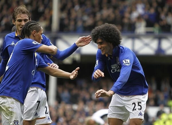 Everton's Triumphant Trio: Fellaini, Jelavic, and Pienaar Celebrate Second Goal vs. Fulham (April 2012)