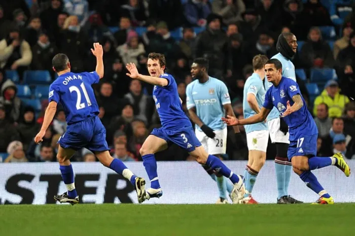 Framed Print : Everton's Triumphant Trio: Tim Cahill, Leon Osman, and Leighton Baines Celebrate Second Goal vs. Manchester City (2010)