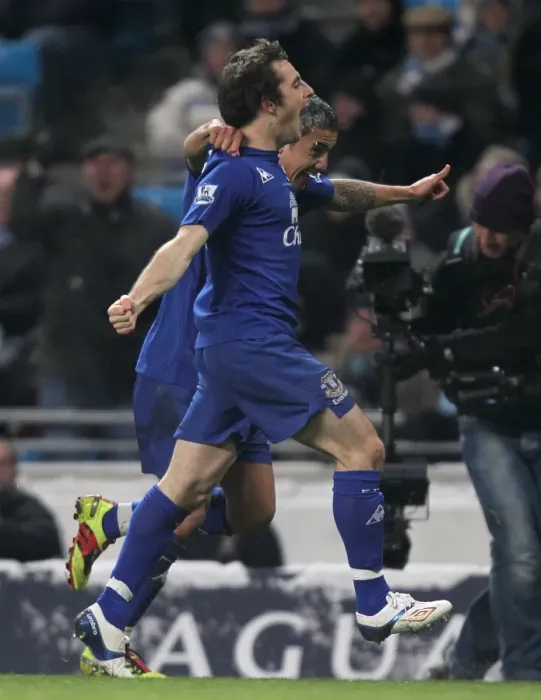Framed Print : Everton's Unforgettable Double Strike: Tim Cahill and Leighton Baines Celebrate Against Manchester City (December 2010)