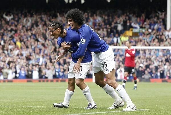 Everton's Unforgettable Moment: Pienaar and Fellaini Celebrate Opening Goal Against Manchester United