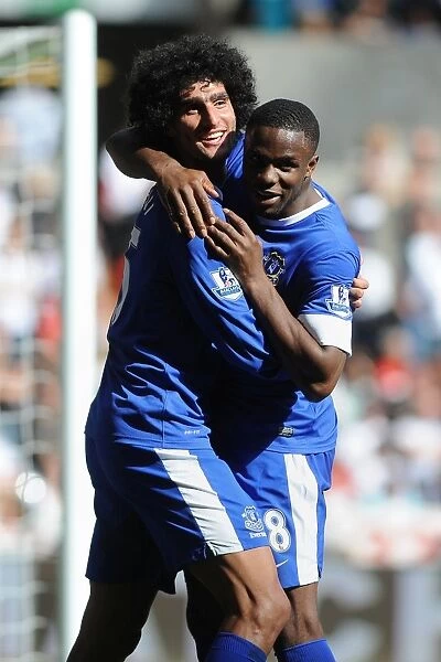 Everton's Unstoppable Duo: Fellaini and Anichebe Celebrate Their Goals in Everton's 3-0 Victory Over Swansea City (Premier League, September 22, 2012)