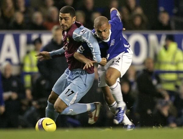 Evertons Vaughan challenges West Ham Uniteds Mullins for the ball during their English Premier Lea
