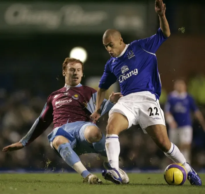 Framed Print : Evertons Vaughan challenges West Ham Uniteds Collins for the ball during their English Premier Lea Framed Print : Evertons Vaughan challenges West Ham Uniteds Collins for the ball during their English Premier Lea