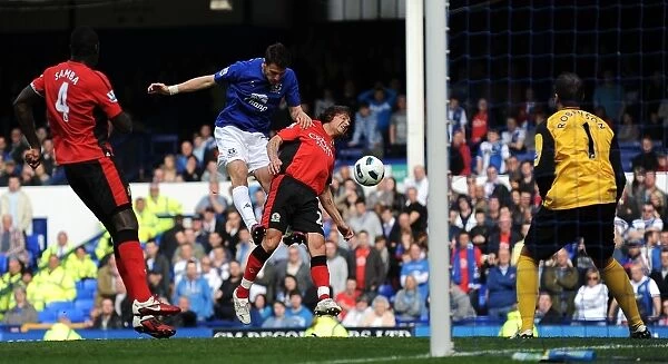 Everton's Vellios Goes for Glory: Thrilling Headed Attempt vs. Blackburn Rovers in Premier League (16 April 2011, Goodison Park)