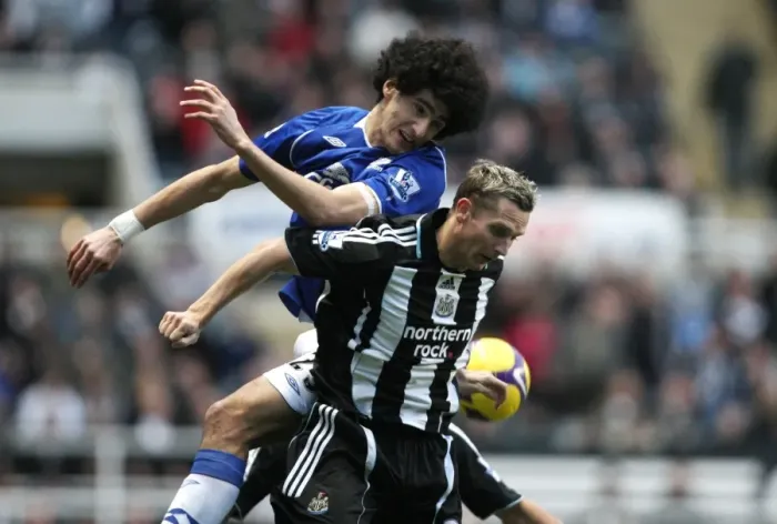 Framed Print : Fellaini vs. Lovenkrands: Intense Rivalry in Premier League Football - Newcastle United vs. Everton Framed Print : Fellaini vs. Lovenkrands: Intense Rivalry in Premier League Football - Newcastle United vs. Everton