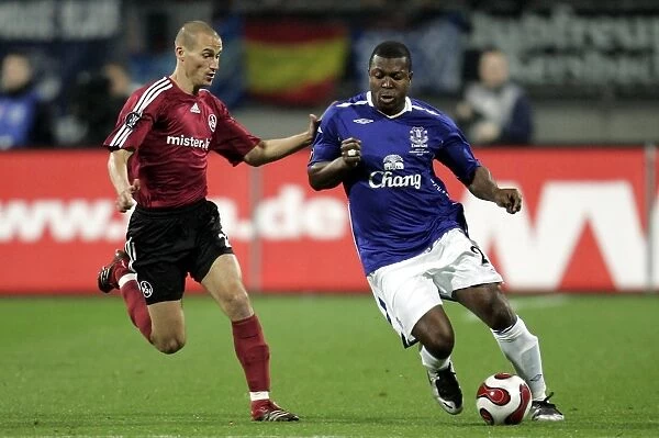 Football - FC Nurnberg v Everton UEFA Cup Group Stage - Second Round Matchday Two Group A - EasyCredit-Stadion, Nurnberg, Germany - 8 / 11 / 07 Evertons Yakubu in action with Nurnbergs Peer Kluge (L) Mandatory Credit: Action Images  /  Keith