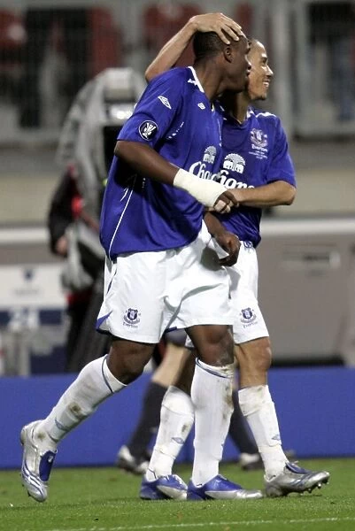 Football - FC Nurnberg v Everton UEFA Cup Group Stage - Second Round Matchday Two Group A - EasyCredit-Stadion, Nurnberg, Germany - 8 / 11 / 07 Evertons Victor Anichebe (L) celebrates scoring his sides second goal with Steven Pienaar (R) Mandatory Credit: Action Images  /  Keith
