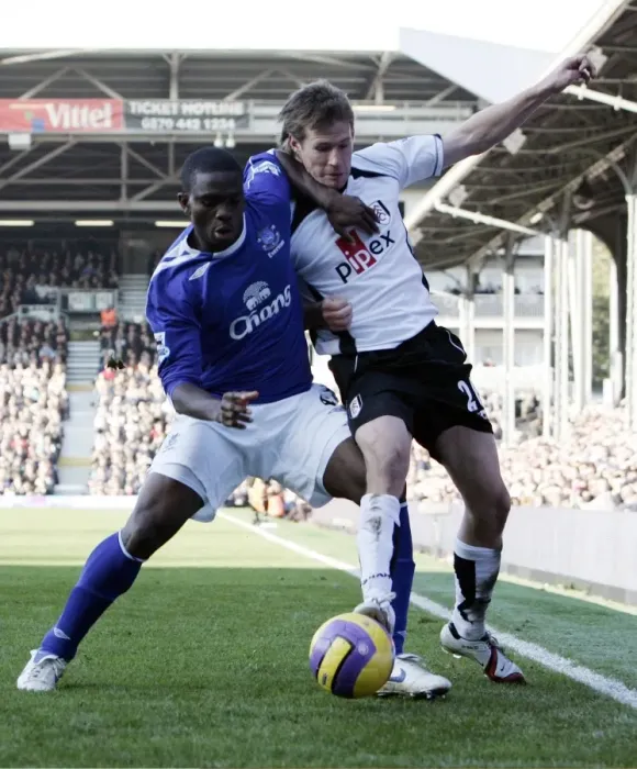 Framed Print : Fulham v Everton - 4  /  11  /  06 Fulhams Brian McBride in action against Evertons Joseph Yobo