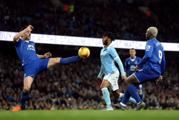 Framed Print : Gareth Barry vs Raheem Sterling: Intense Battle for the Ball in Everton vs Manchester City Capital One Cup Semi-Final Framed Print : Gareth Barry vs Raheem Sterling: Intense Battle for the Ball in Everton vs Manchester City Capital One Cup Semi-Final