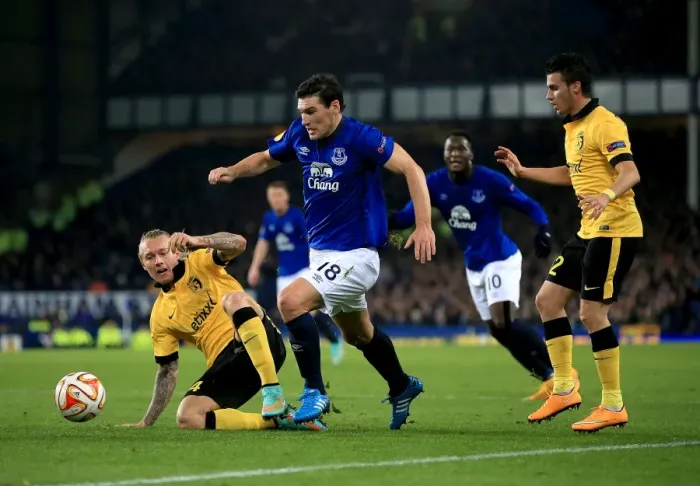 Framed Print : Gareth Barry vs. Simon Kjaer: A Battle for the Ball in Everton vs. Lille UEFA Europa League Clash Framed Print : Gareth Barry vs. Simon Kjaer: A Battle for the Ball in Everton vs. Lille UEFA Europa League Clash
