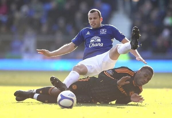 Heating Up the Pitch: A Battle Between Heitinga and Drogba - Everton vs. Chelsea FA Cup Fourth Round Clash (29 January 2011)