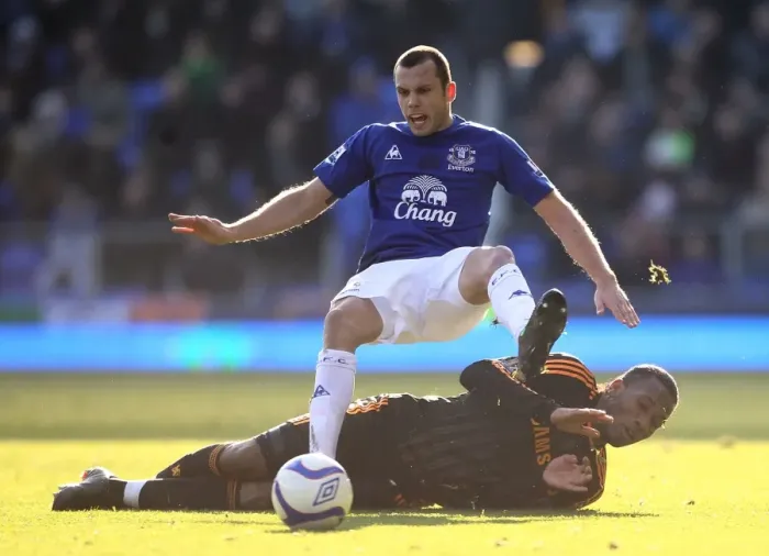 Framed Print : Heitinga vs. Drogba: Everton vs. Chelsea's Intense FA Cup Fourth Round Battle at Goodison Park