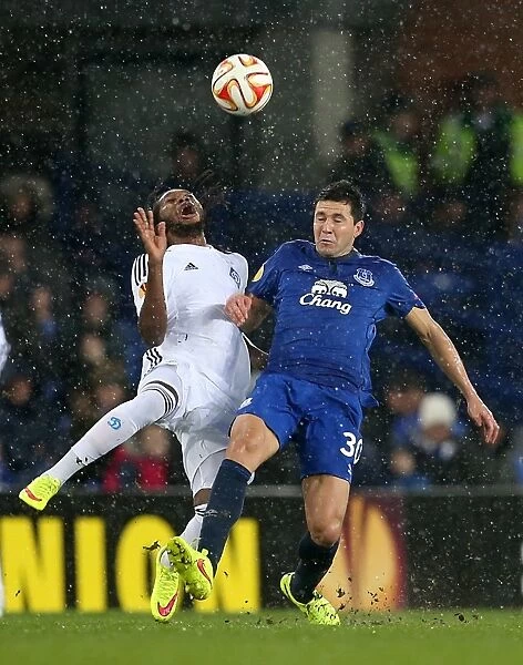 Intense Battle for Ball Possession: Mbokani vs. Alcaraz in Everton vs. Dynamo Kiev Europa League Clash